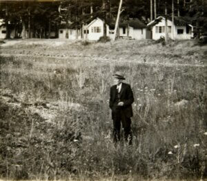 Alfred Tarte standing in pit remains of Indian Village - Birch Bay PRJ 1345
