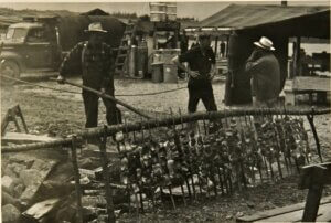 Salmon baking at Lummi Stommish. c1953 Buswell # 283.2